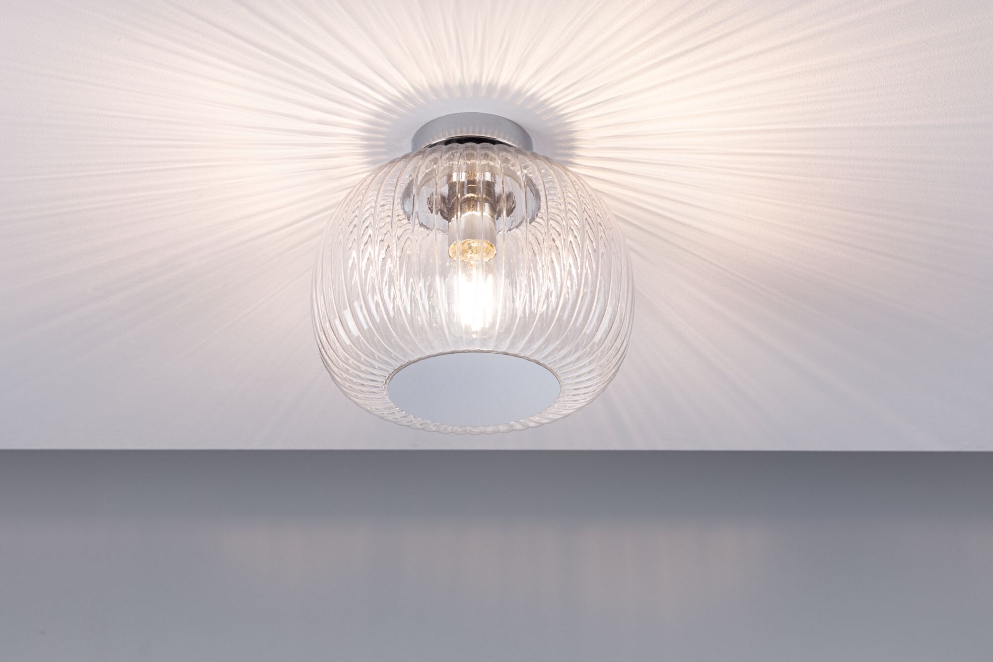 Ceiling light with ribbed clear glass and warm white light for elegant room illumination