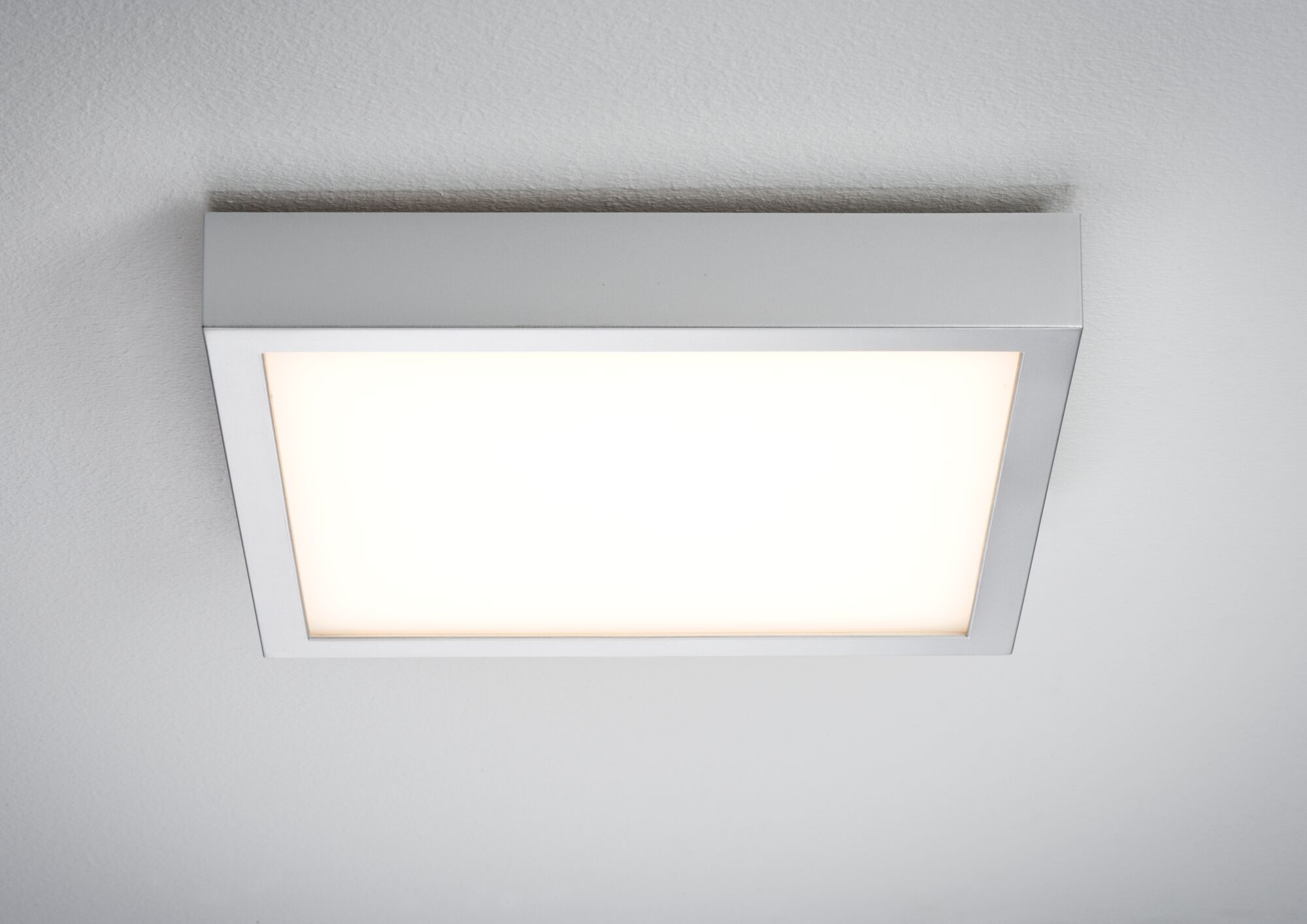 Square aluminum-colored LED ceiling light with warm white illumination for modern interiors