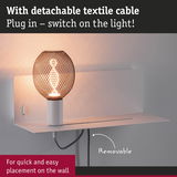 Wall lamp with detachable textile cable and black metal mesh for easy mounting and warm lighting