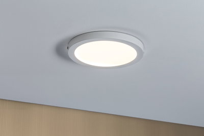 Round white LED ceiling light with warm white glow for modern interiors and energy-efficient lighting
