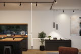 Modern living room with black sideboard, wooden countertop, and black pendant lights on ceiling