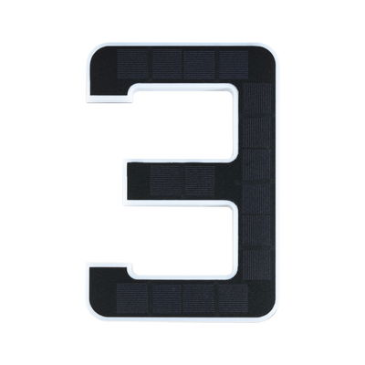 Black solar cells shaped as number 3 with white frame, energy-saving LED lighting element