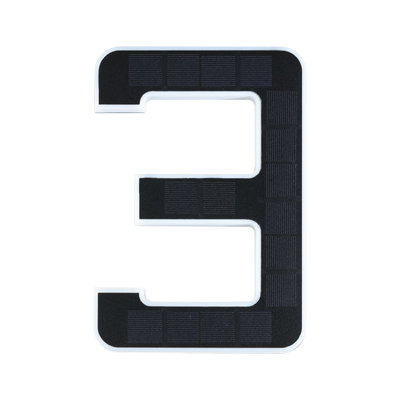 Black solar cells shaped as number 3 with white frame, energy-saving LED lighting element