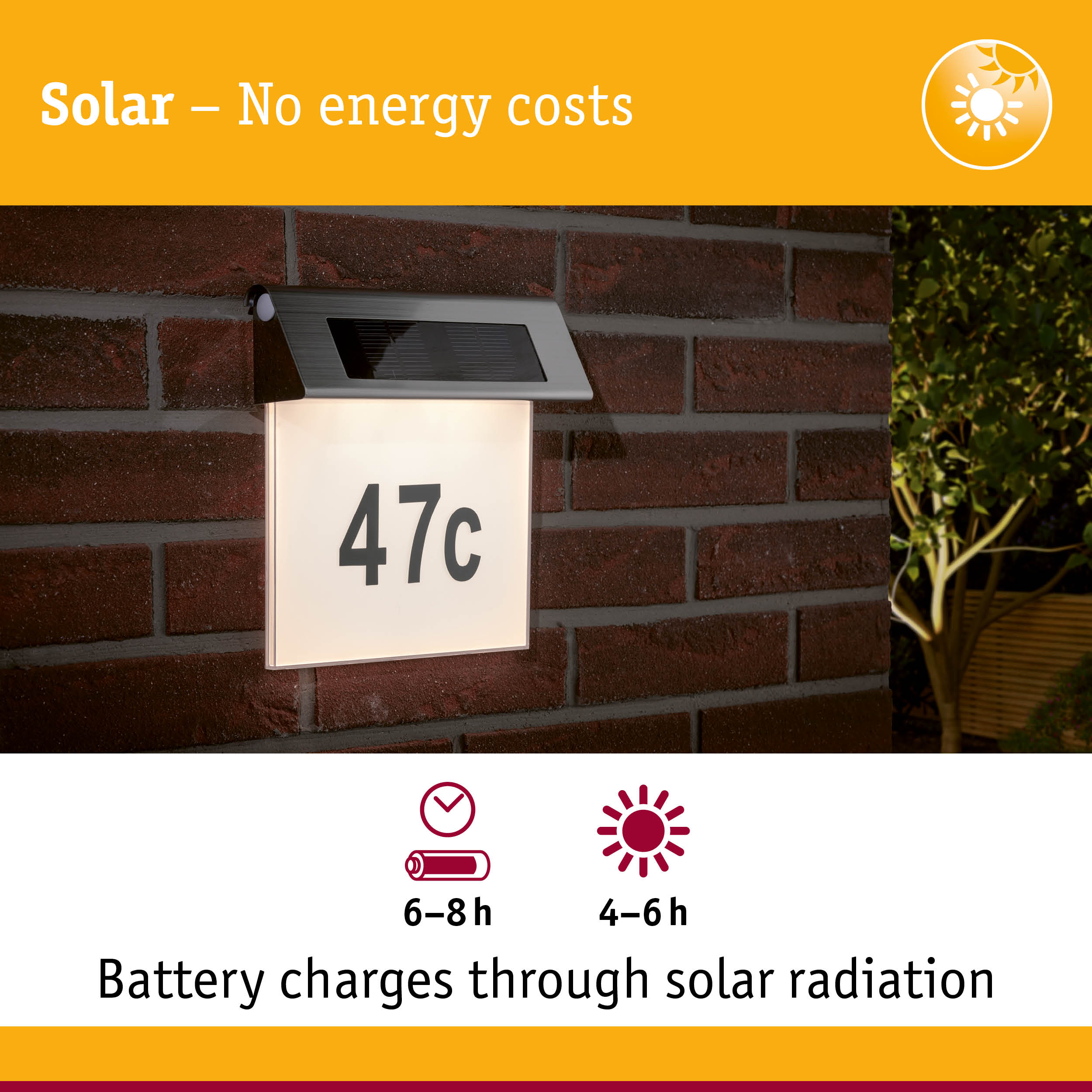 Solar-powered house number light with stainless steel top and white illuminated panel on red brick wall