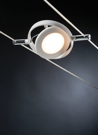White metal LED cable spotlight with warm white light for modern interior lighting