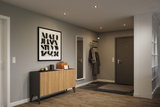 Modern hallway with warm white LED recessed lights in grey and wood tones for stylish lighting