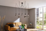 Modern living room lighting with five hanging bulbs and brown sofa against grey wall