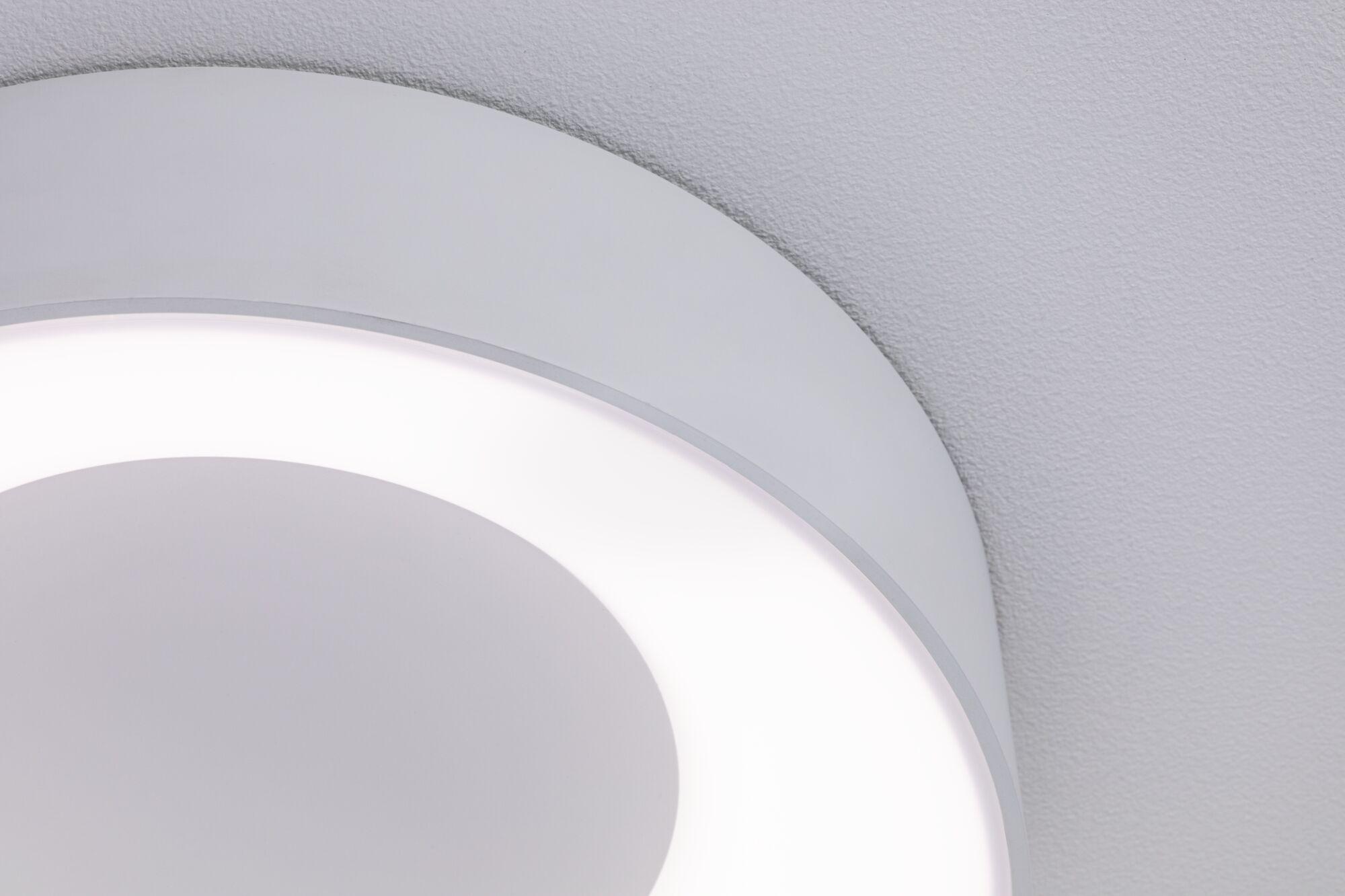 Close-up of white round LED ceiling light with diffused glow and modern minimalist design