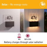 Solar-powered house number 47c with black solar panel and LED light for energy-saving outdoor lighting