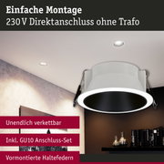 Weißer Einbaustrahler mit schwarzem Innenring und vormontierten Haltefedern für 230V Direktanschluss