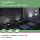 Outdoor warm white ground lights creating atmospheric terrace and garden illumination
