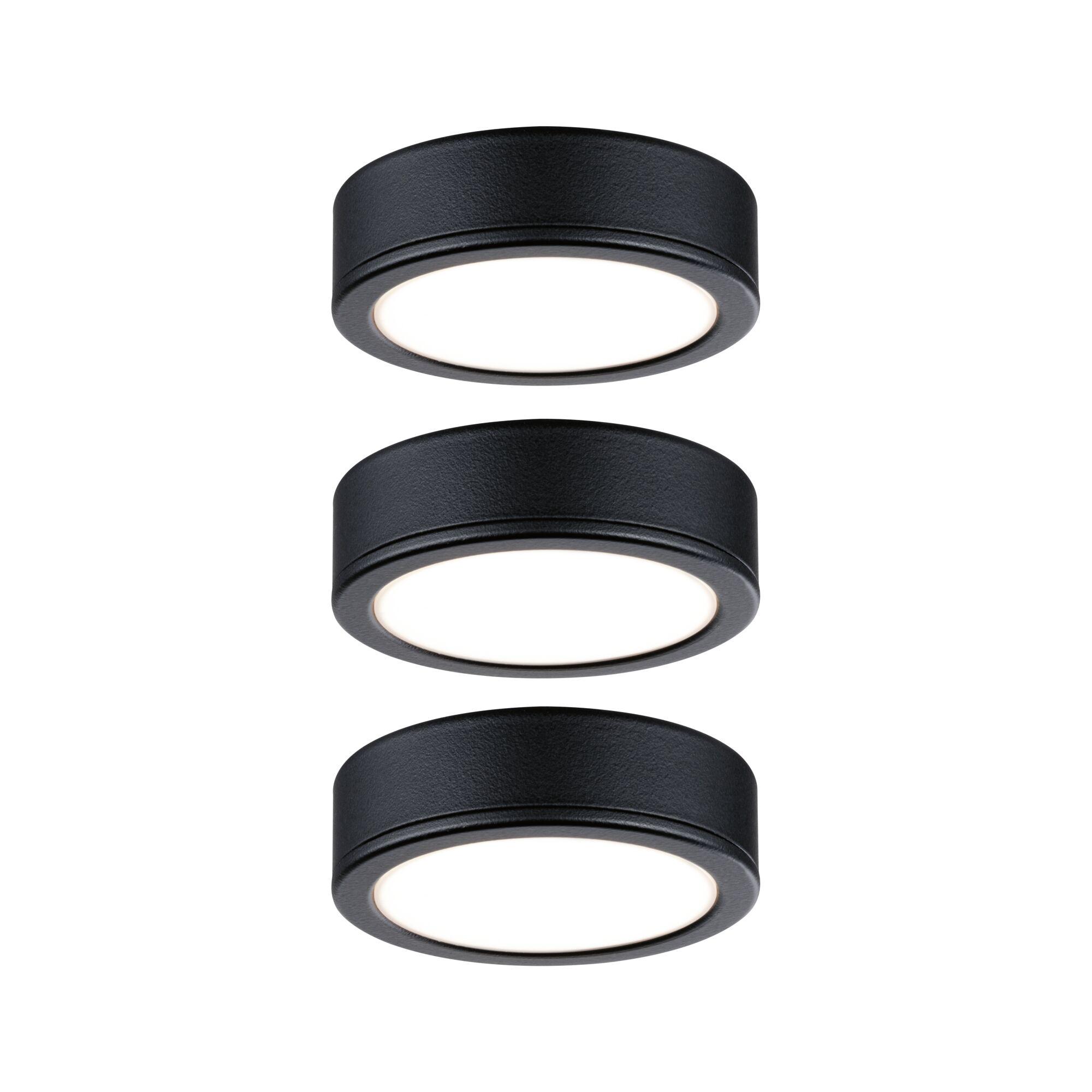 Trois plafonniers LED ronds en métal noir avec diffuseur blanc pour éclairage intérieur moderne