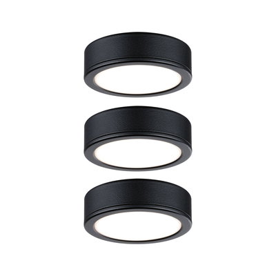 Three round black LED ceiling lights with matte aluminum housing and warm white light