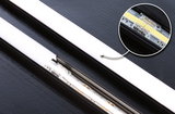 Black LED strip with white diffuser and close-up of LED connector for modern lighting solutions