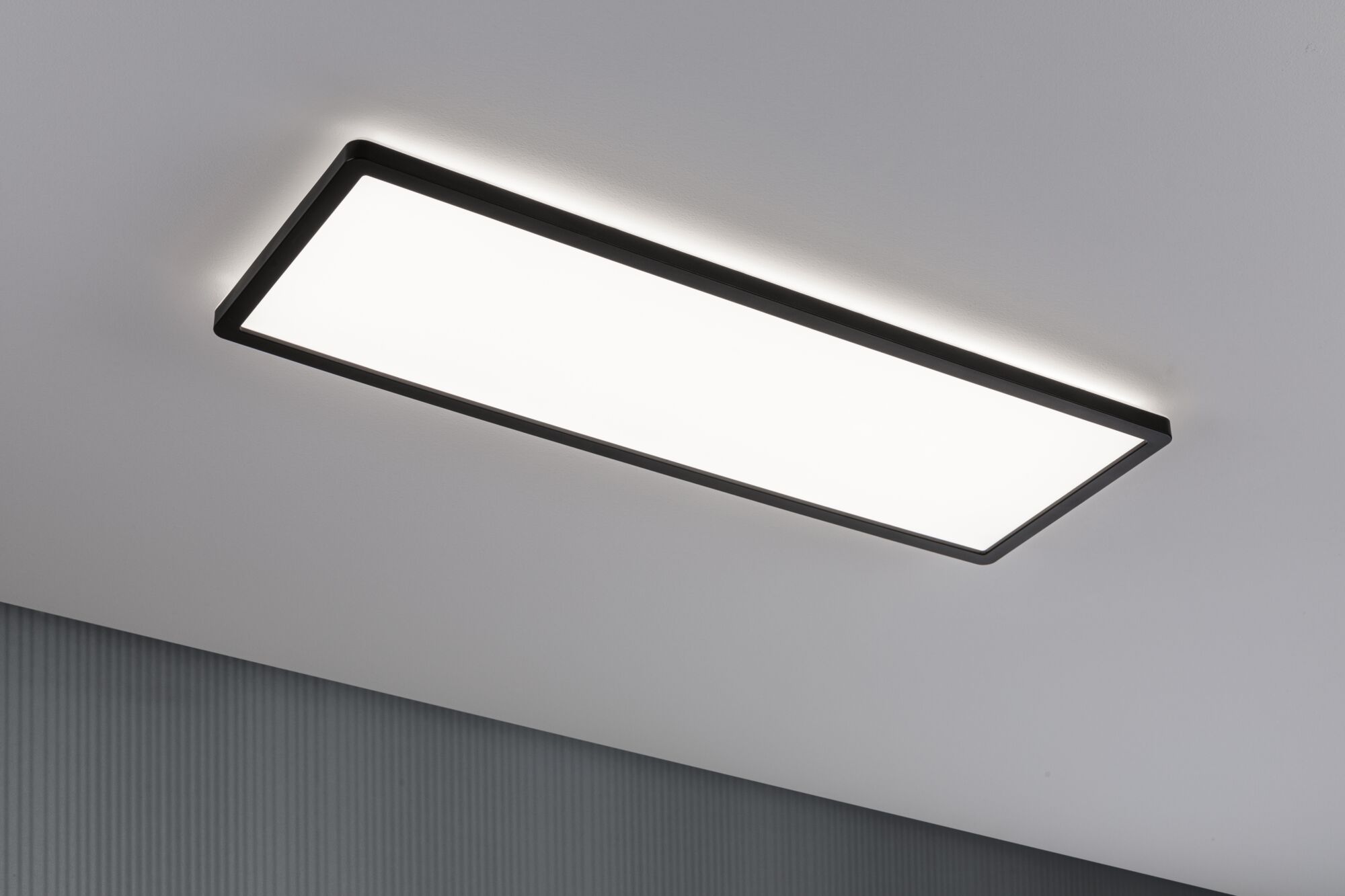 Rectangular LED ceiling light with black frame and indirect lighting for modern interior design