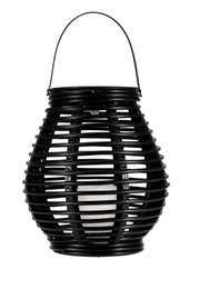 Black plastic lantern with handle and white candle light for atmospheric indoor lighting