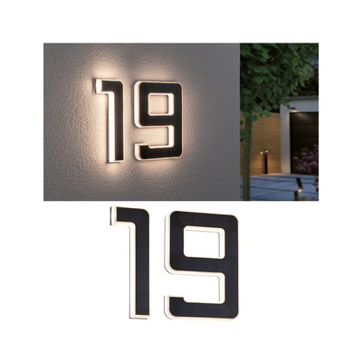Modern house number 19 with black solar panels and warm white LED light for outdoor walls.