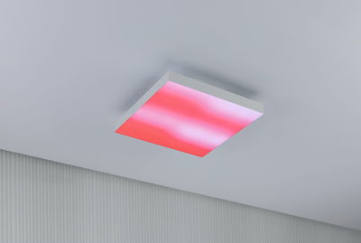 Square LED ceiling light with white frame and red illumination for modern living spaces