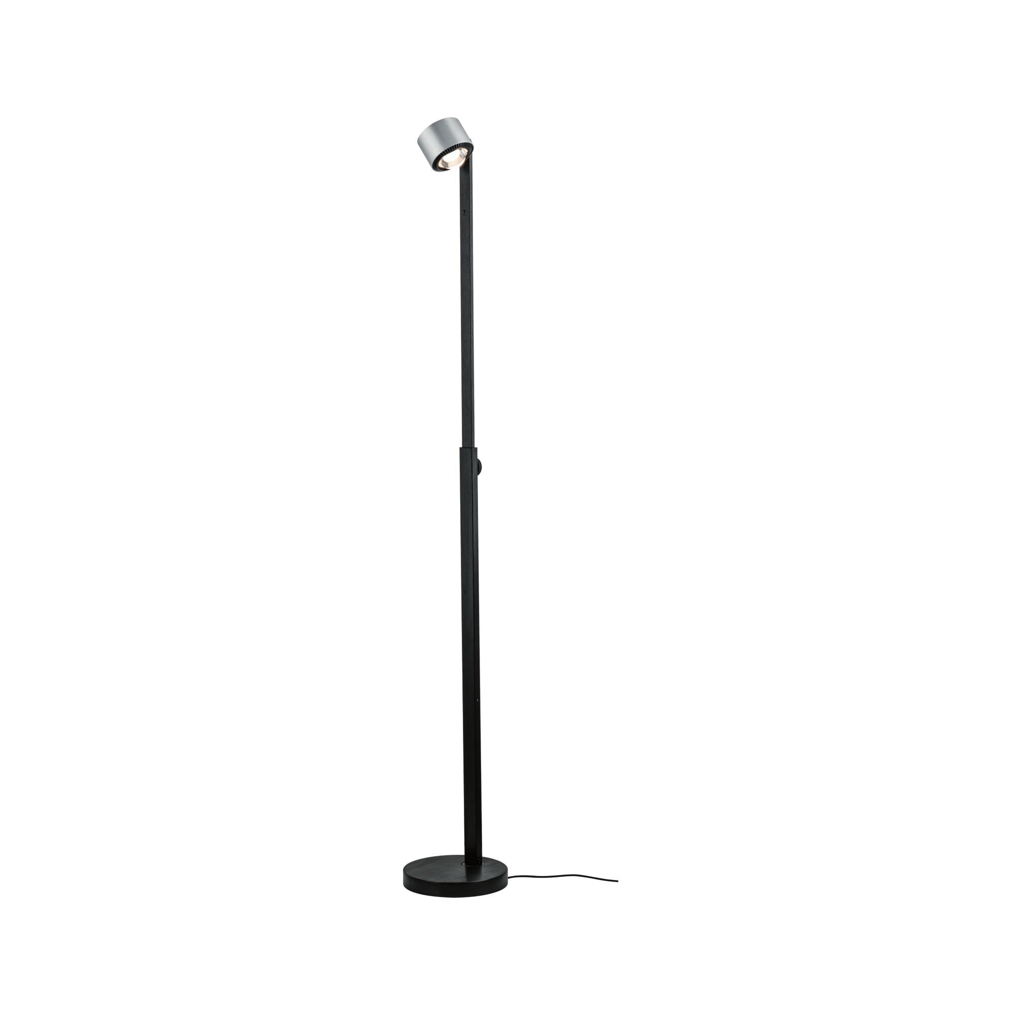 Black metal floor lamp with round base and adjustable head for focused lighting in living spaces