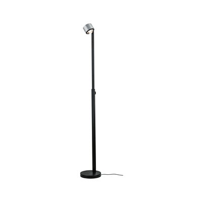 Black metal floor lamp with round base and adjustable head for focused lighting in living spaces