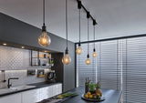 Modern kitchen with black pendant lights and white tiles, stylish LED lighting for living space.
