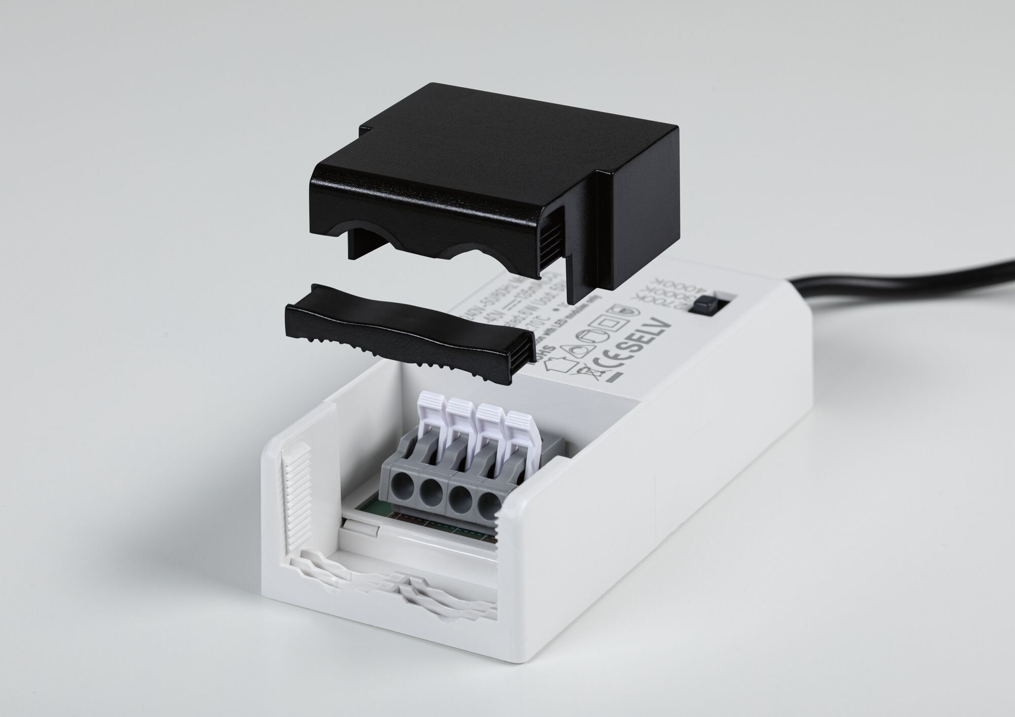 White electrical connector box with removable black cover and four terminals for LED lighting installation