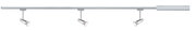 Three silver LED spotlights on straight metal track system for flexible room lighting