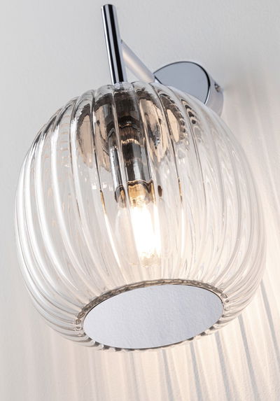 Wall light with ribbed clear glass and chrome metal mount for modern interior lighting