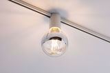 Modern ceiling spotlight with clear glass globe and white metal housing for living spaces.